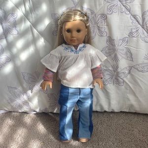 “Julie” American girl doll. Including an outfit and earrings.